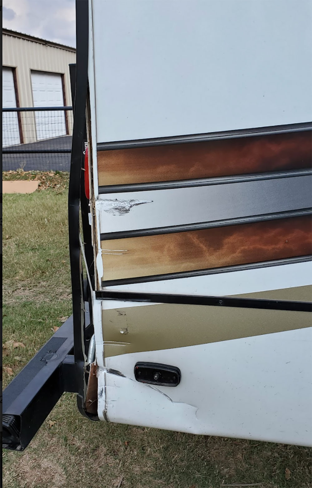 rv with rear corner damage from collision