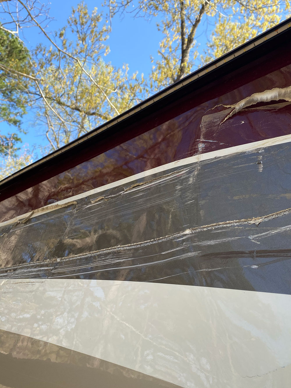 rv with side wall fiberglass and paint damage