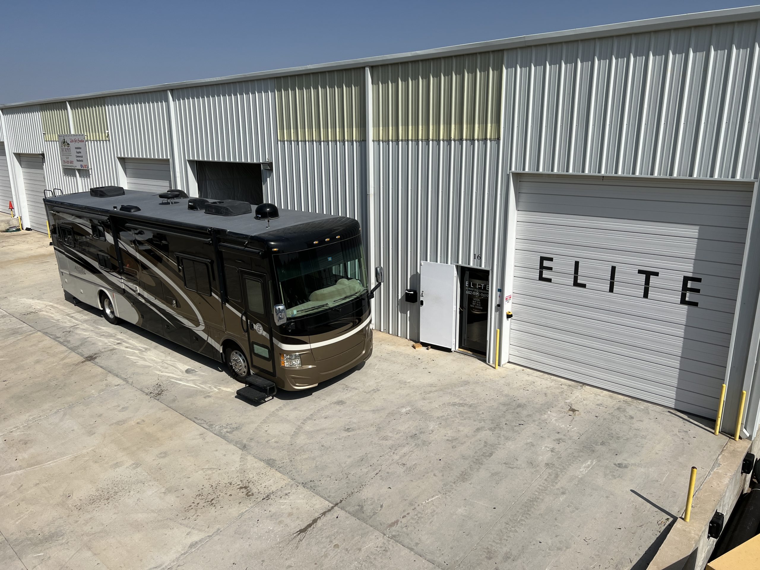 rv motorcoach parked at elite rv repair shop