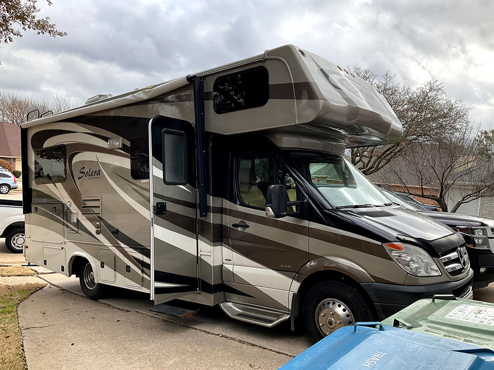 class c rv parked in parking lot