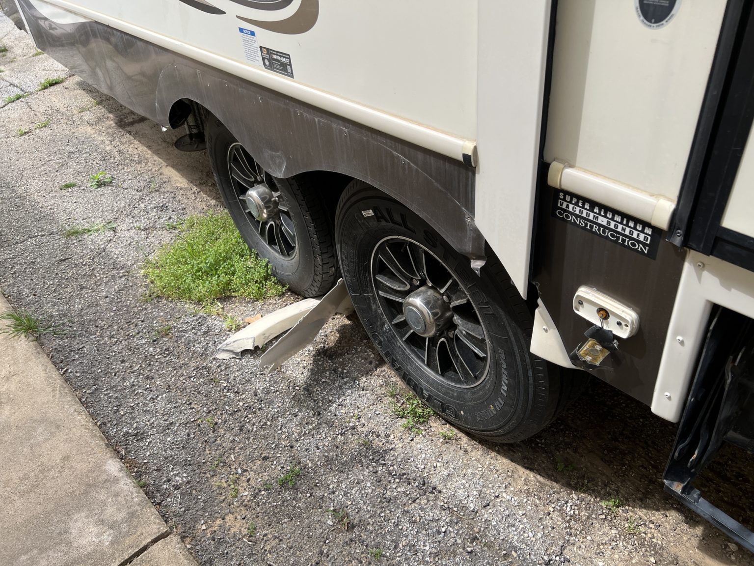 rv with damage from a tire blowout