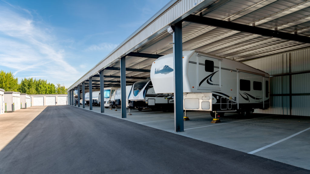 row of rvs parked in storage