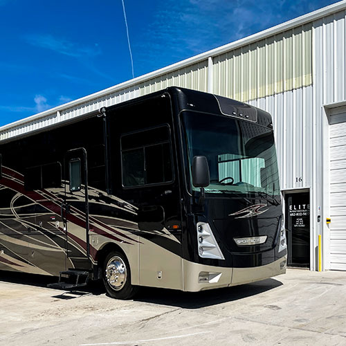 large motorcoach parked at elite rv repair center